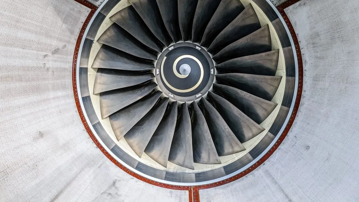 Jet engine turbine fan undergoing aerospace maintenance