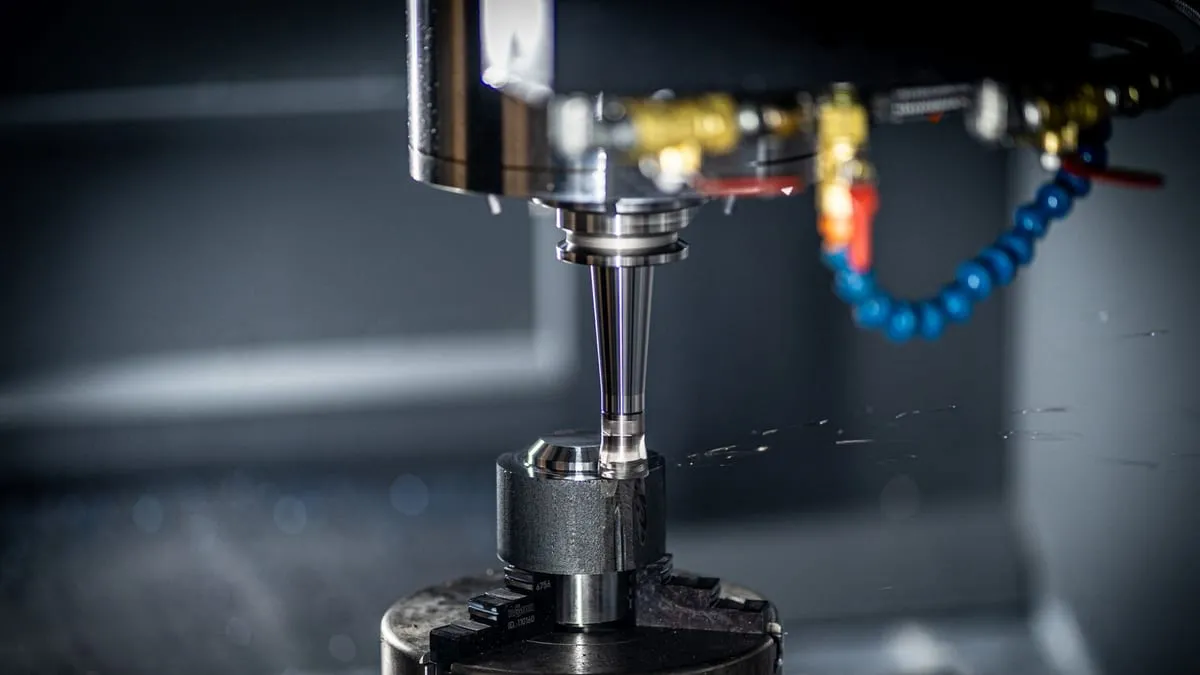 CNC milling machine cutting a metal component