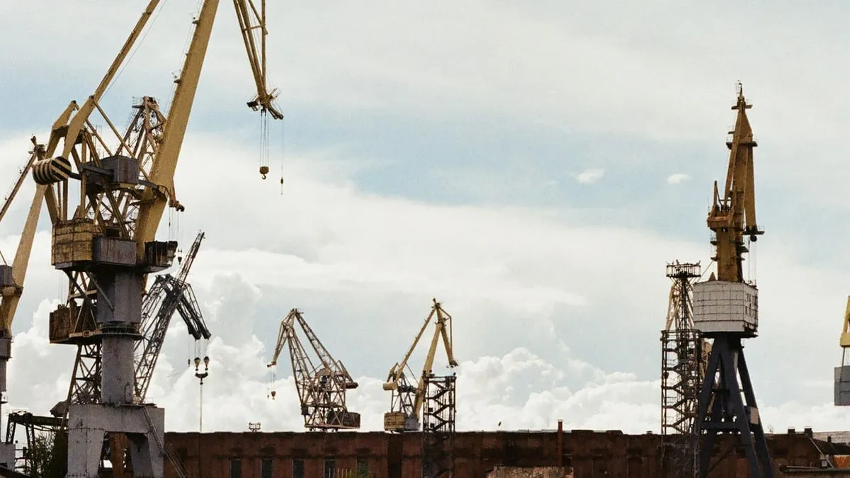 Shipyard cranes above a vessel repair dock
